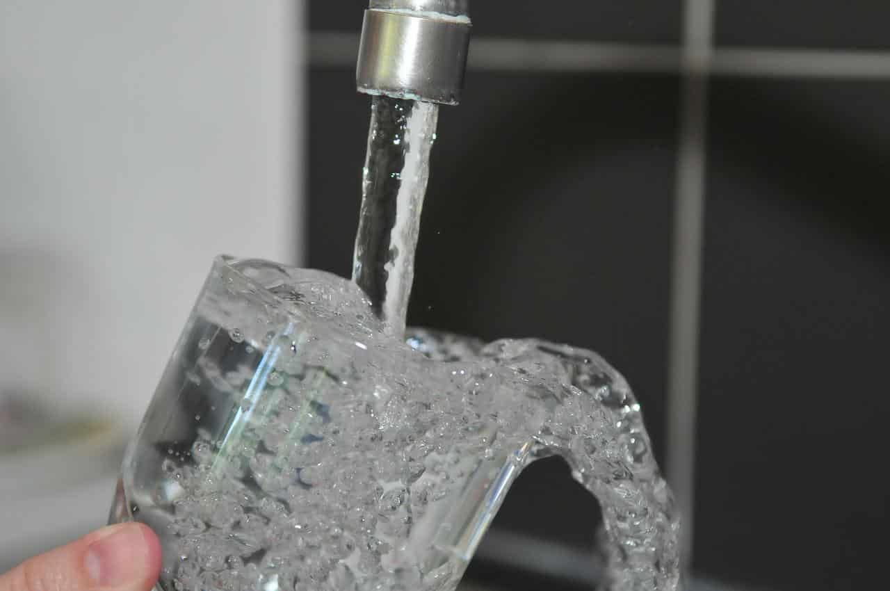 filling glass with tap water
