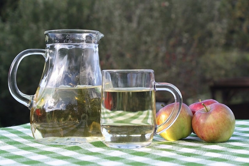 mug and jug full of apple cider vinegar